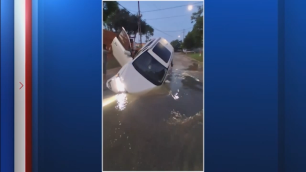 Pavement collapses on Sylvan Road in Idylwood neighborhood in southeast Houston causing deep hole, car gets stuck inside