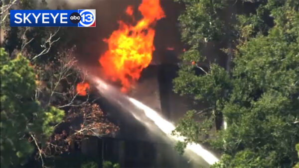 SWAT scene underway in Kingwood after suspect barricades himself, sets fire to home as officials issue arrest warrant