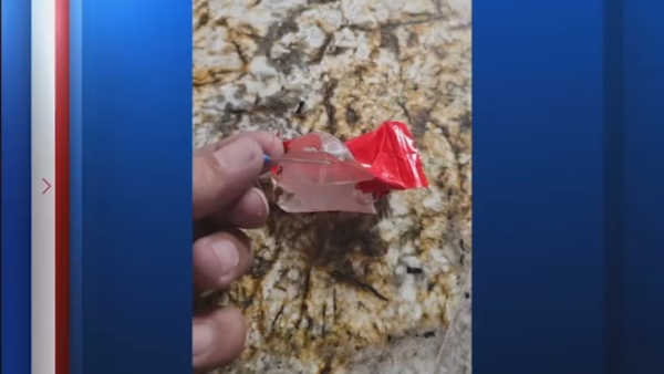 Santa Fe police investigating sewing pins found in candy at homecoming parade